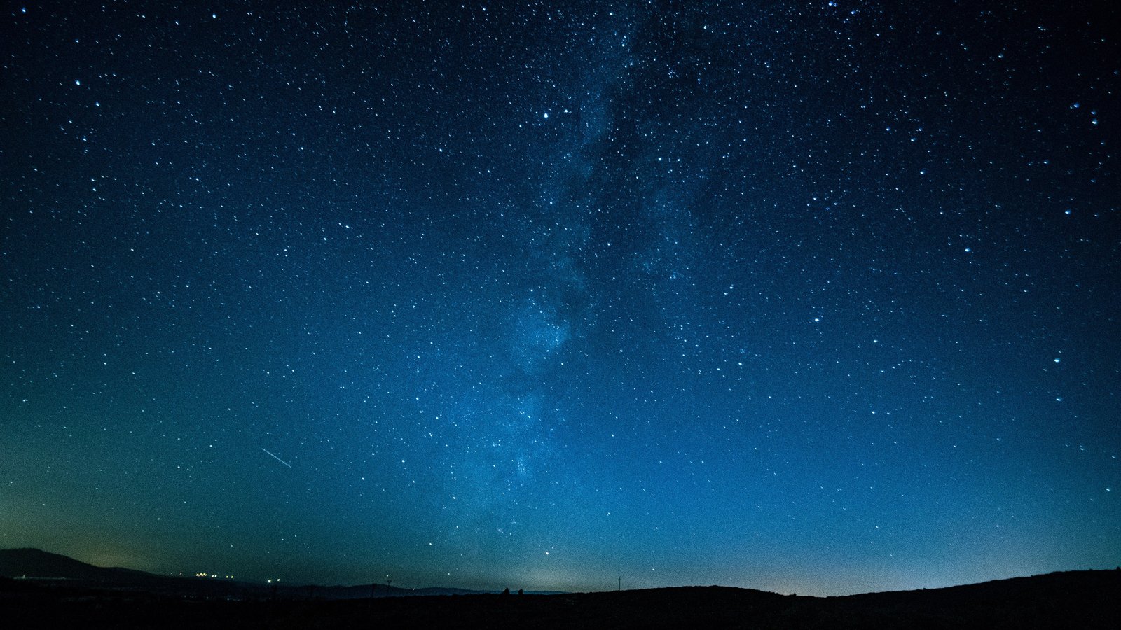 Dark sky stargazing landscape with stars at night